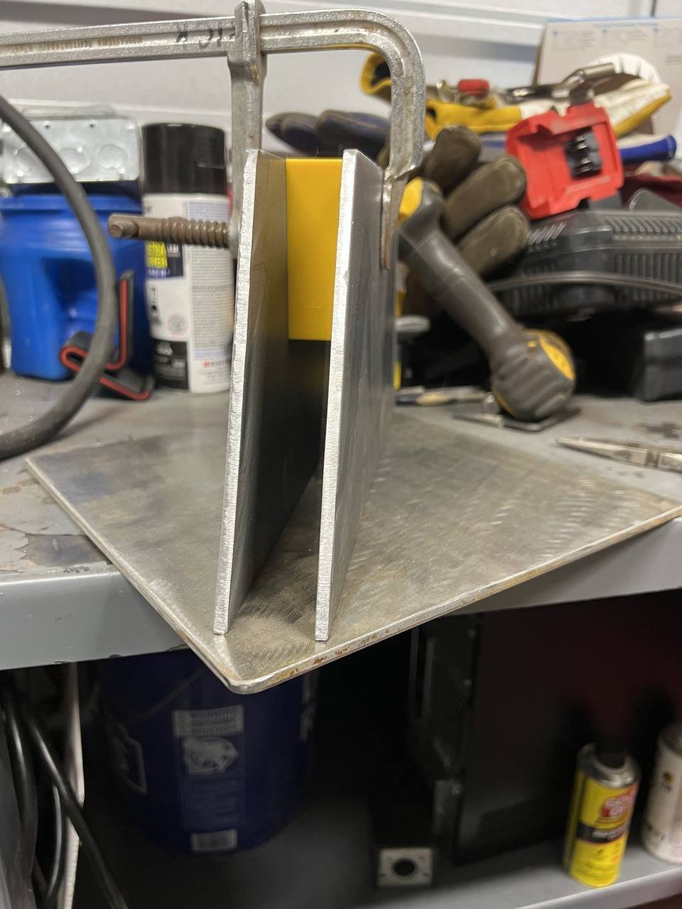 Steel bracket parts clamped for fit-up before welding