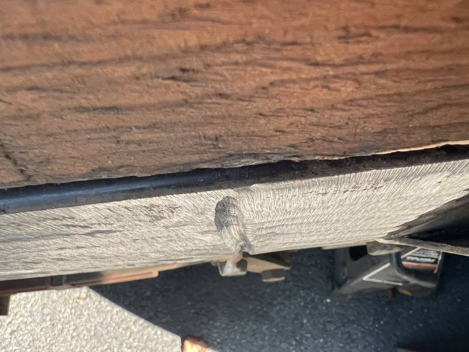 Cracked trailer frame rail before welding repair
